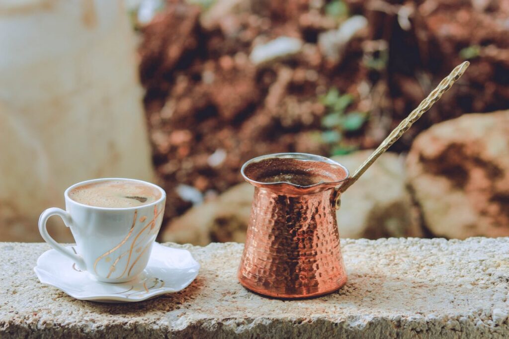 the cezve or ibrik with turkish coffee cup