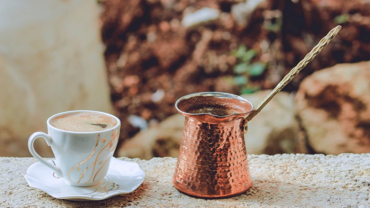 the cezve or ibrik with turkish coffee cup